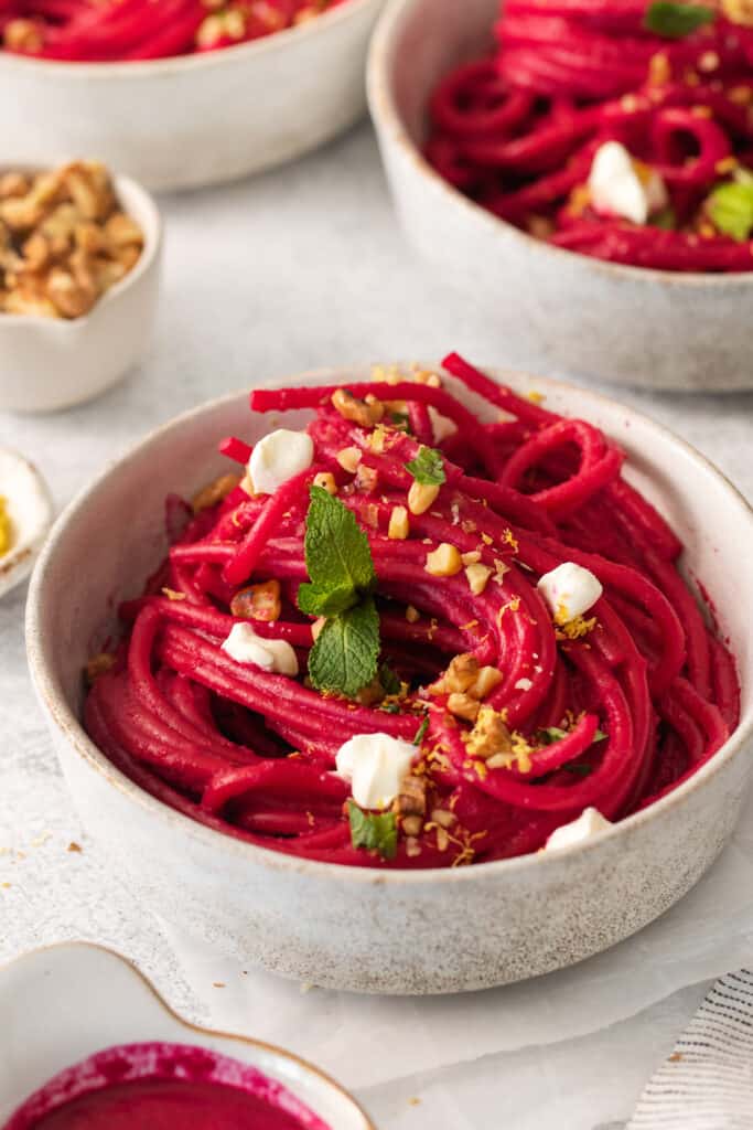 beetroot pasta with feta and pine nuts.