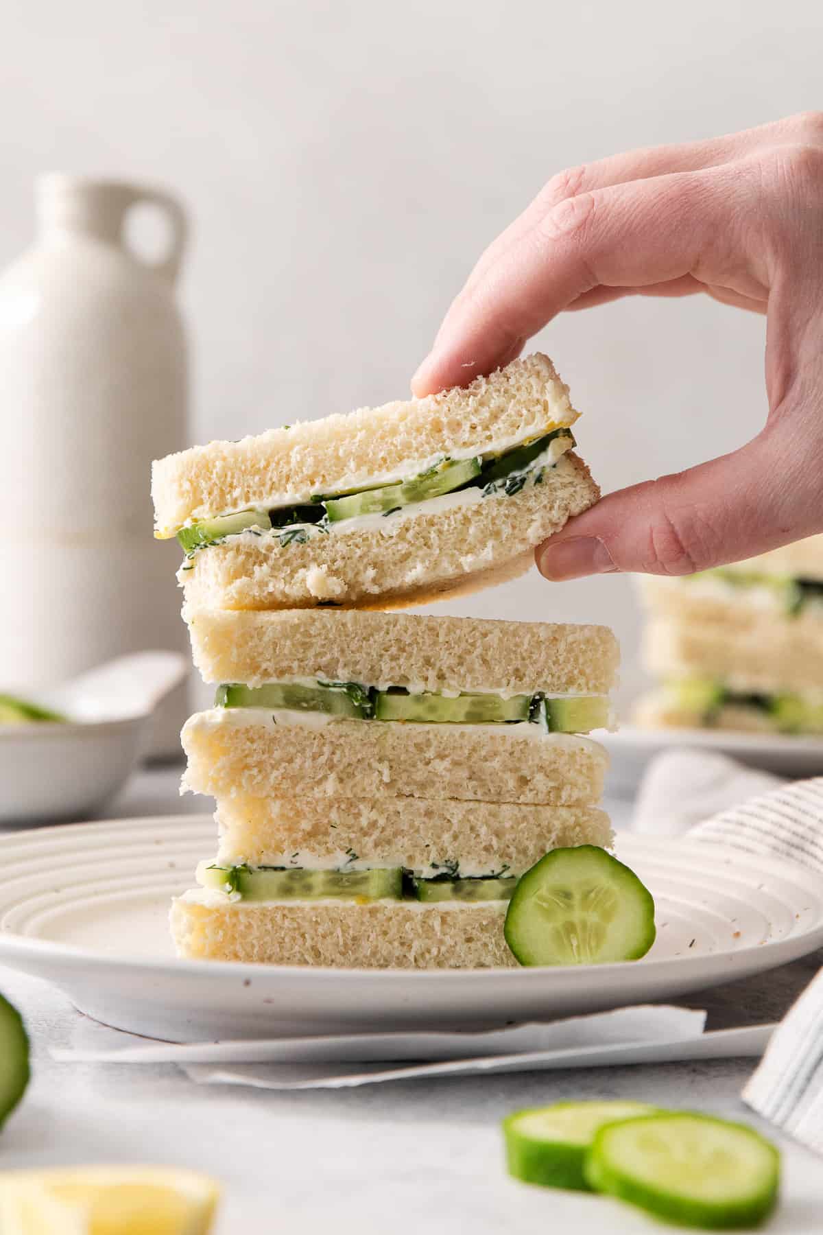 Serving cucumber sandwiches.