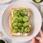 Cucumber sandwiches with cream cheese, cucumbers, and fresh dill.
