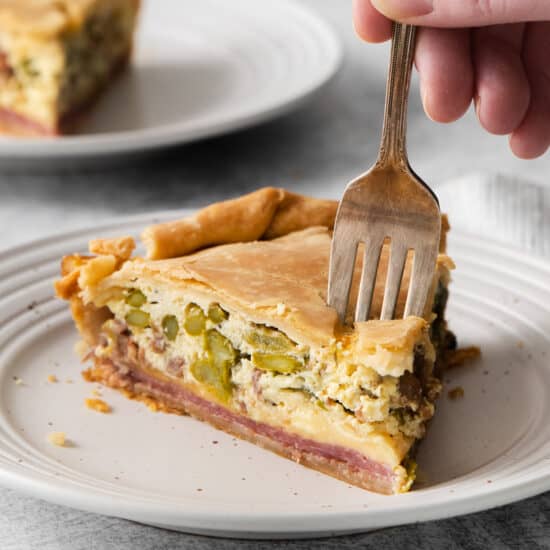 A slice of Italian Easter pie on a plate.