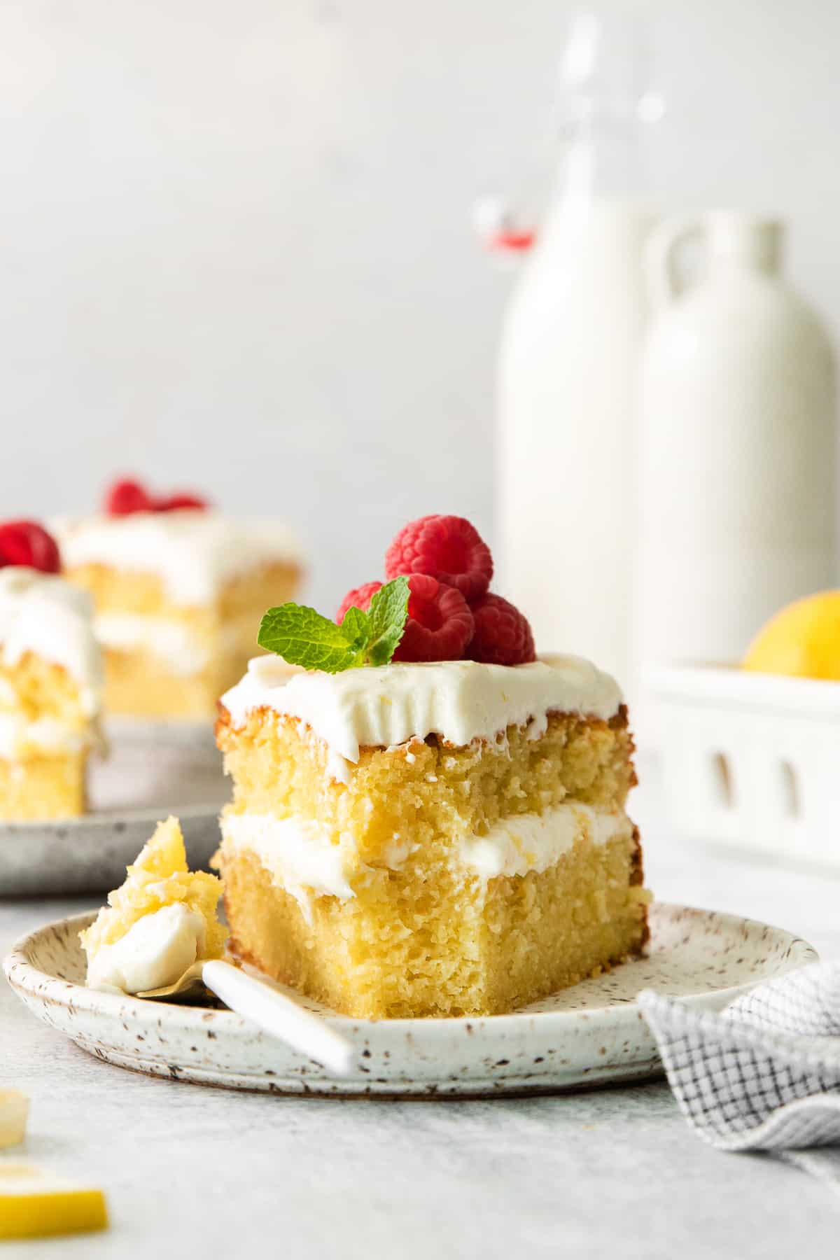 Slice of lemon olive oil cake on a plate.