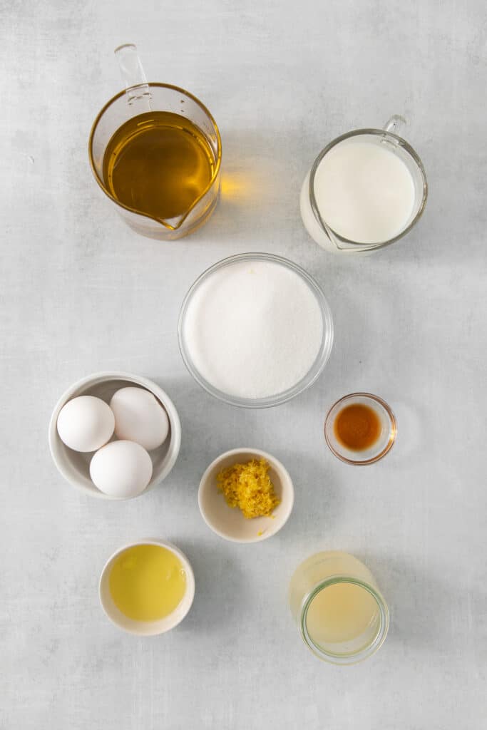 Ingredients for lemon olive oil cake in bowls.