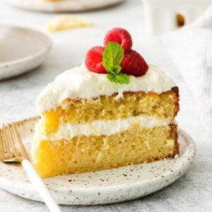 Slice of lemon olive oil cake on a plate.