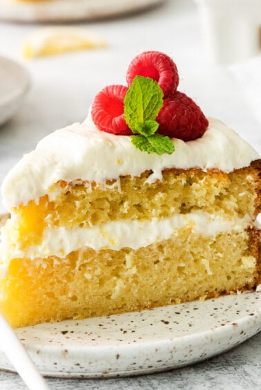 Slice of lemon olive oil cake on a plate.