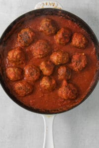 meatballs in tomato sauce in a skillet.