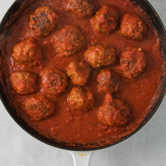 meatballs in tomato sauce in a skillet.