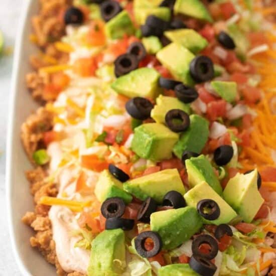 a white platter filled with a taco salad.