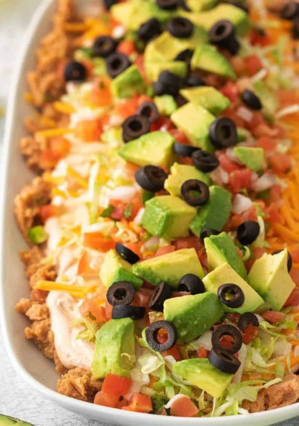 a white platter filled with a taco salad.