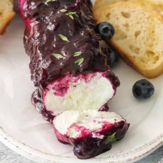 Blueberry goat cheese appetizer on a plate.