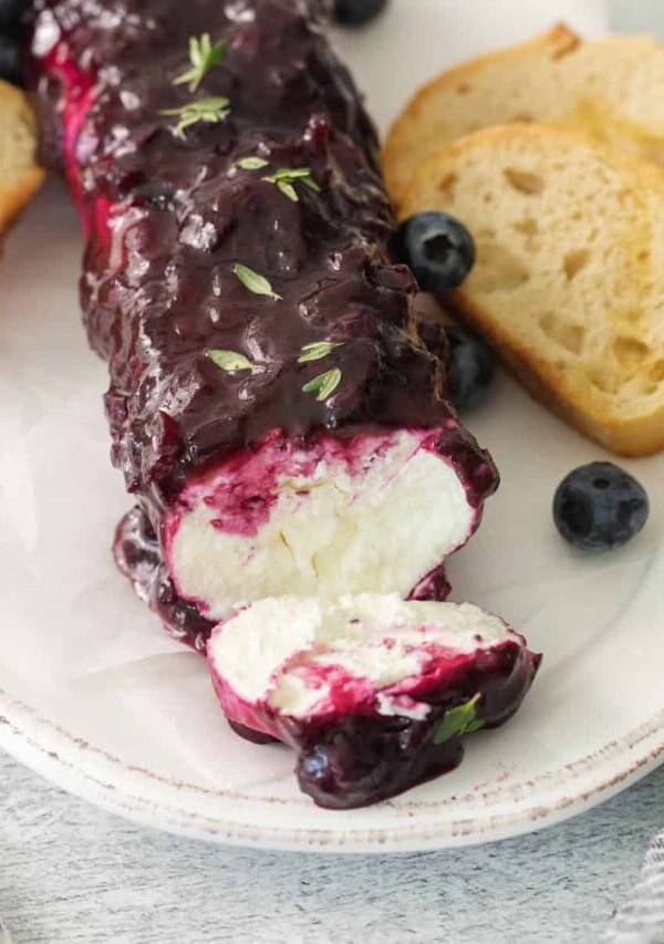 Blueberry goat cheese appetizer on a plate.
