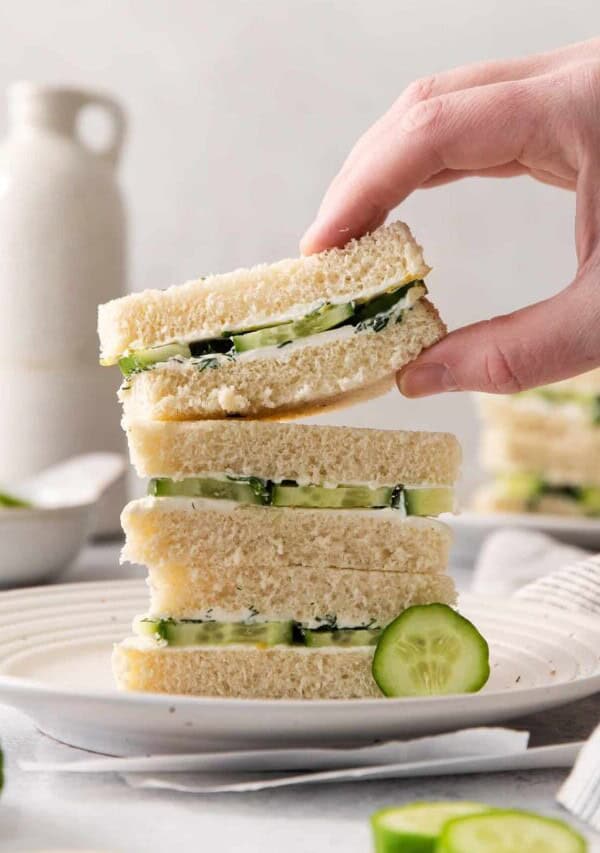 Serving cucumber sandwiches.