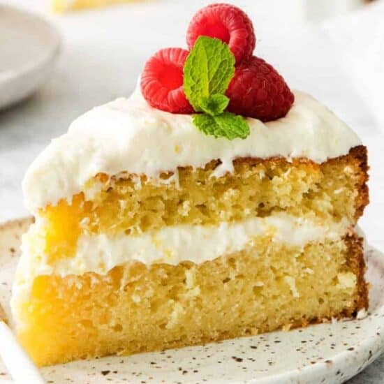 Slice of lemon olive oil cake on a plate.