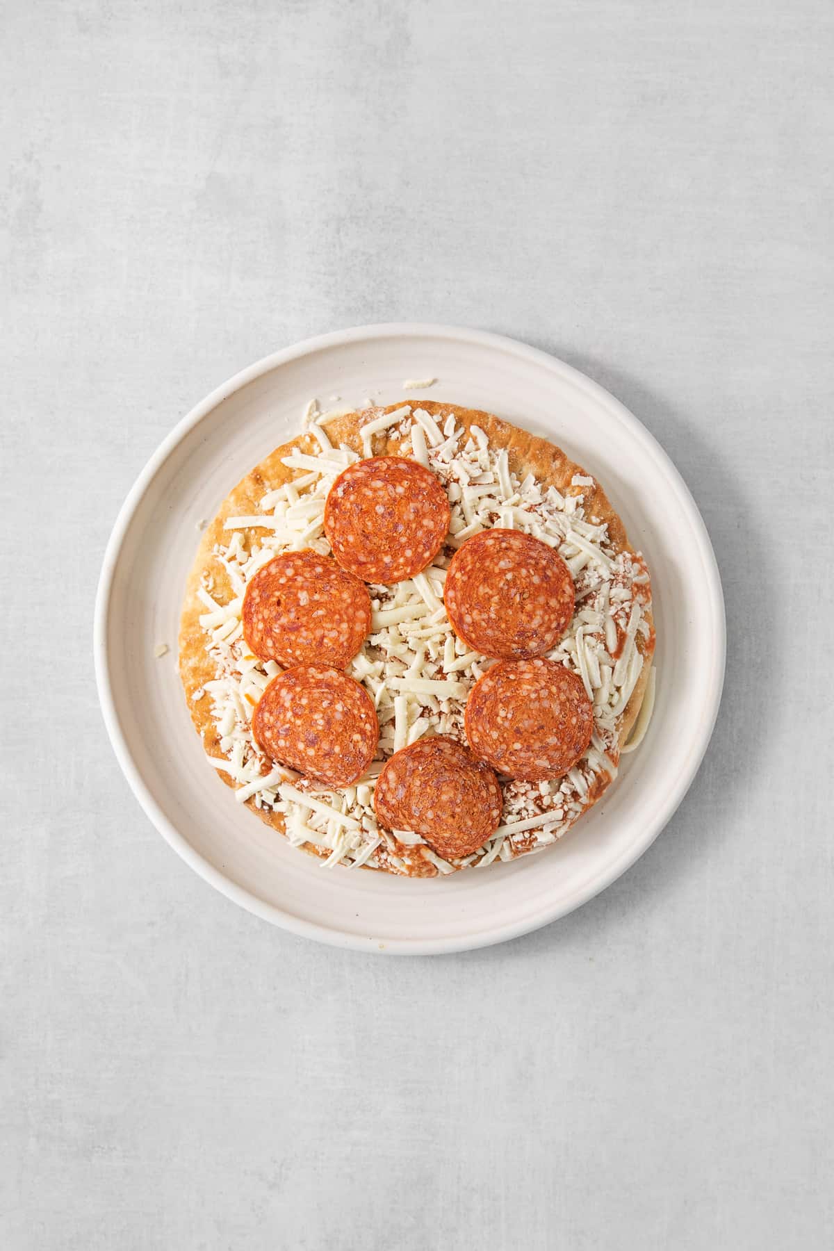 Frozen pizza on a plate.