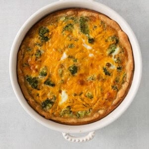 a casserole dish with broccoli and cheese.