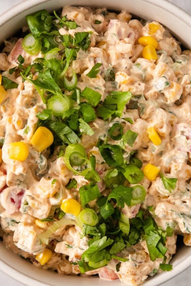 a white bowl filled with a mixture of food.