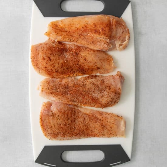 fried fish fillets on a cutting board.