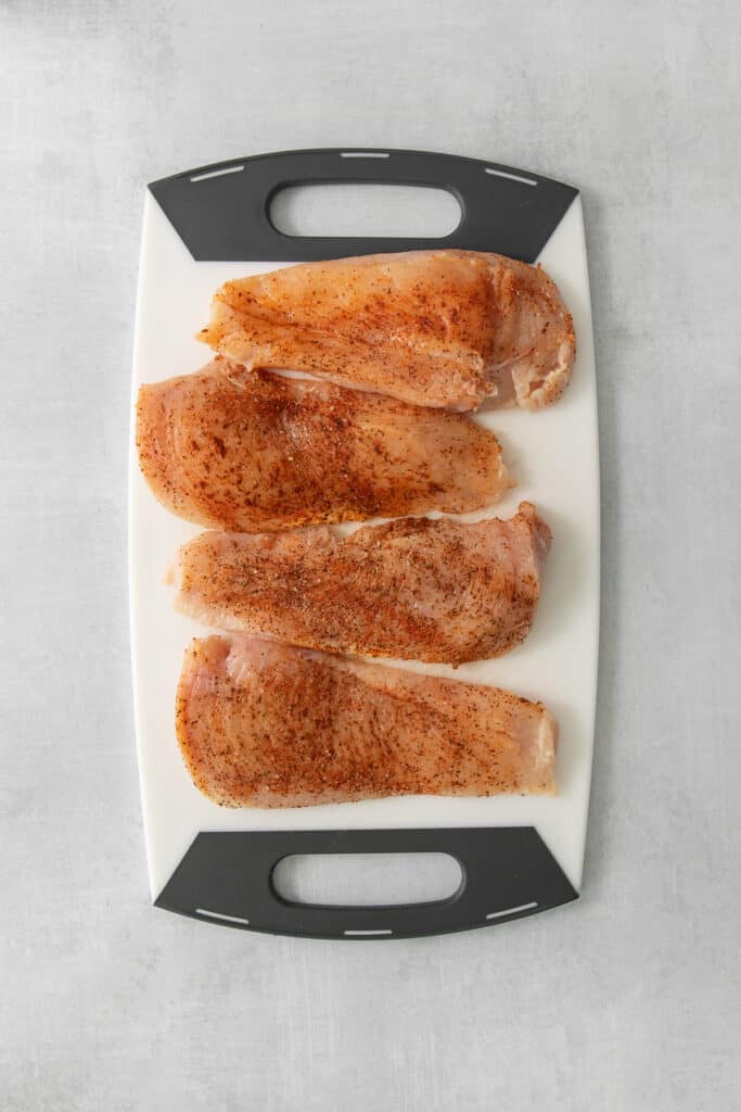 fried fish fillets on a cutting board.