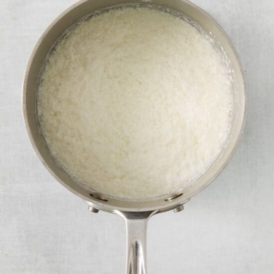 rice in a pan on a white background.