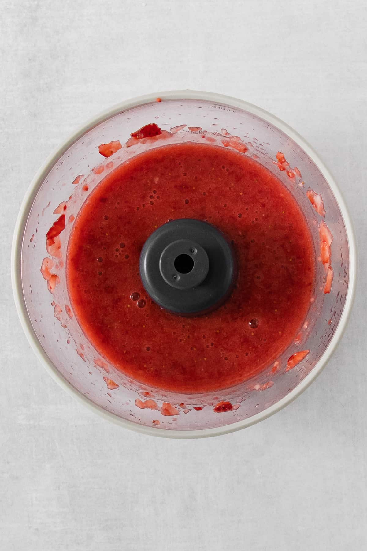 strawberry sauce in a food processor.