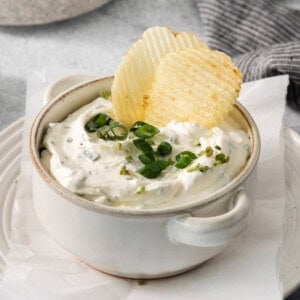 Copycat top the tater in a bowl with potato chips.