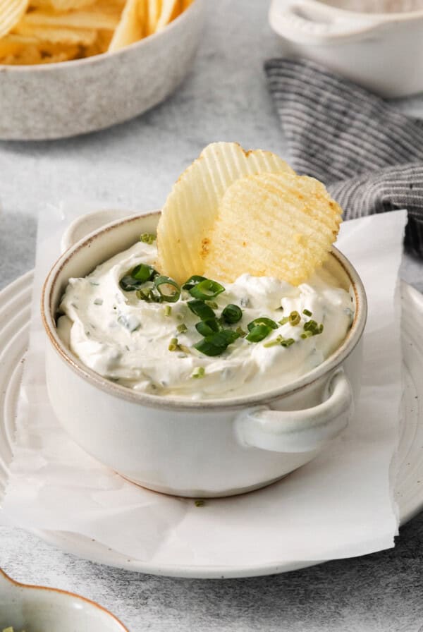 Copycat top the tater in a bowl with potato chips.