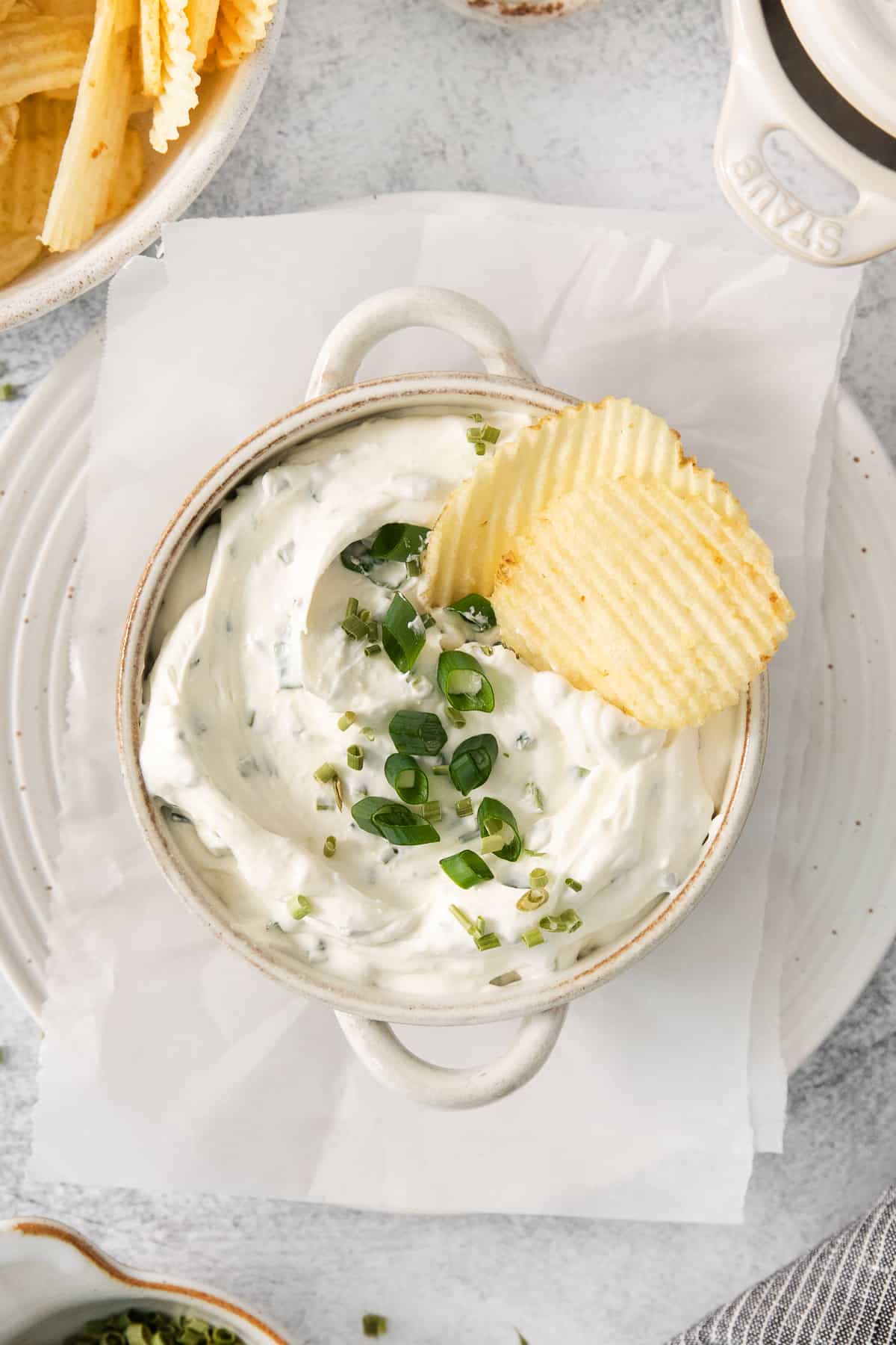 Copycat top the tater in a bowl with potato chips.