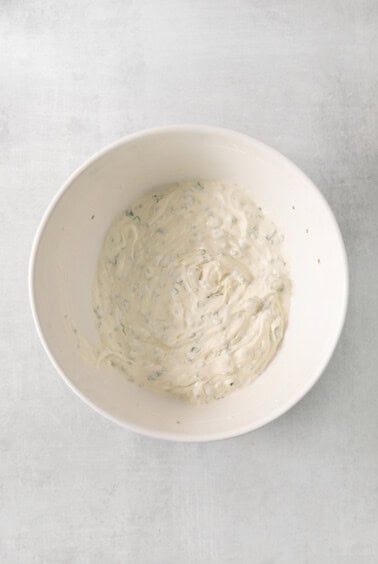 Top the tater mixed together in a bowl.