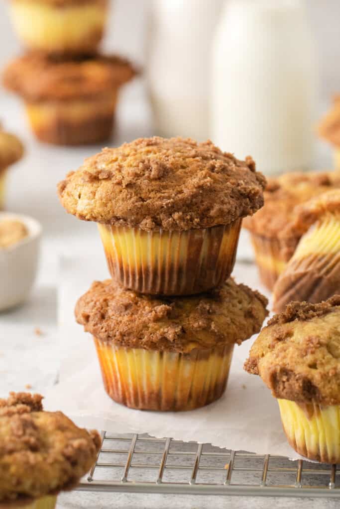 a stack of muffins on a cooling rack.