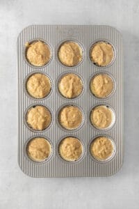 a muffin pan filled with muffins.