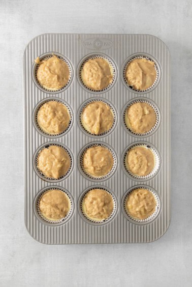a muffin pan filled with muffins.