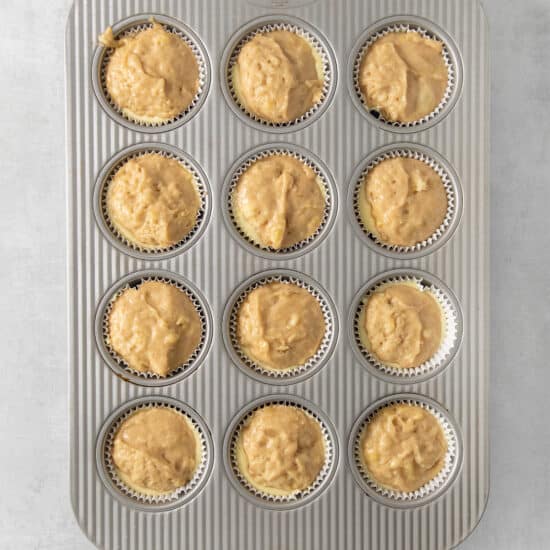 a muffin pan filled with muffins.
