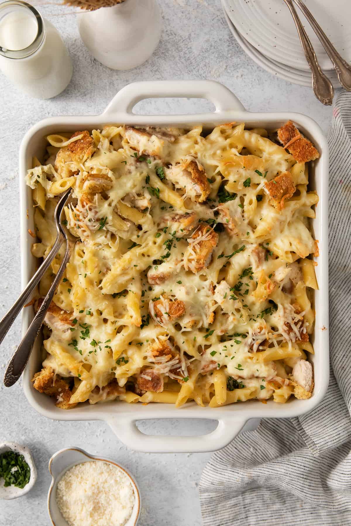 a casserole dish filled with chicken and pasta.