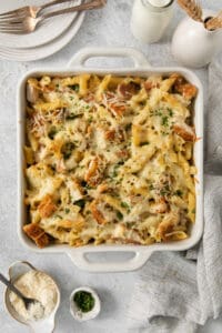 a casserole dish with chicken and pasta in it.
