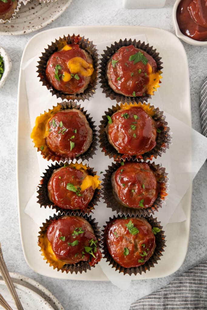 cheesy meatball cups on a white plate.