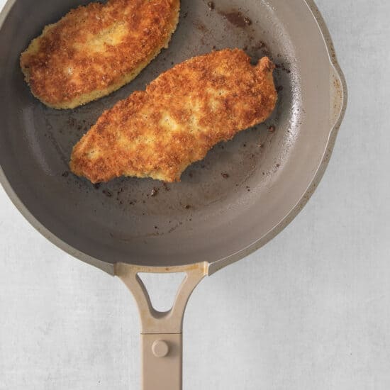fried chicken in a frying pan.