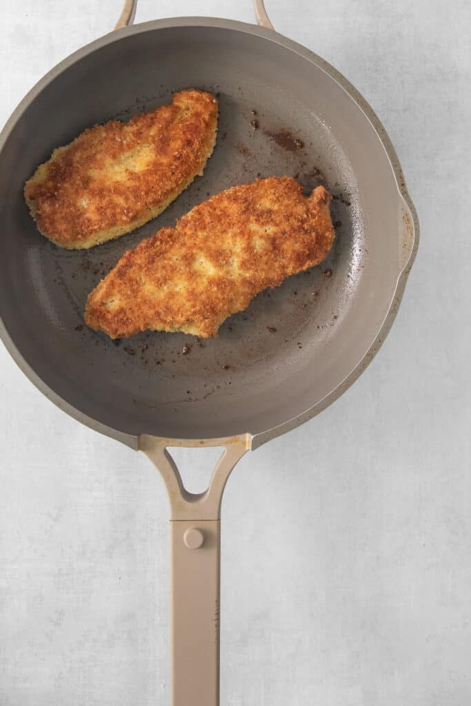 fried chicken in a frying pan.
