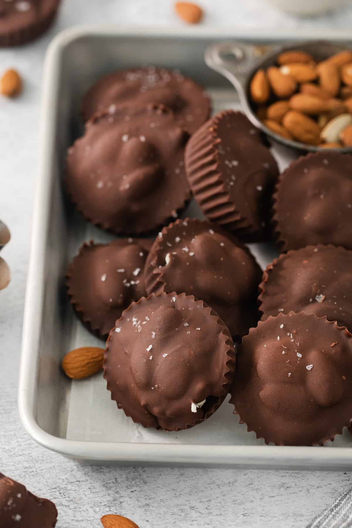 a tray of chocolates and nuts on a table.