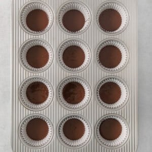 a muffin tin filled with chocolate cupcakes.