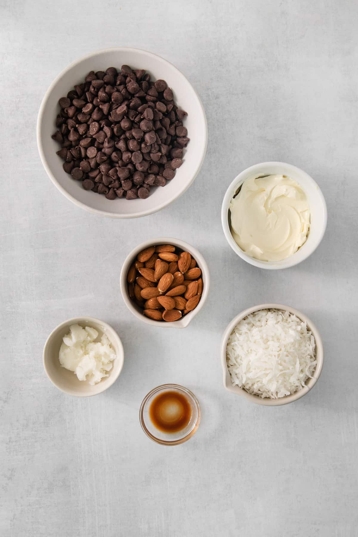 a table topped with bowls filled with different types of food.