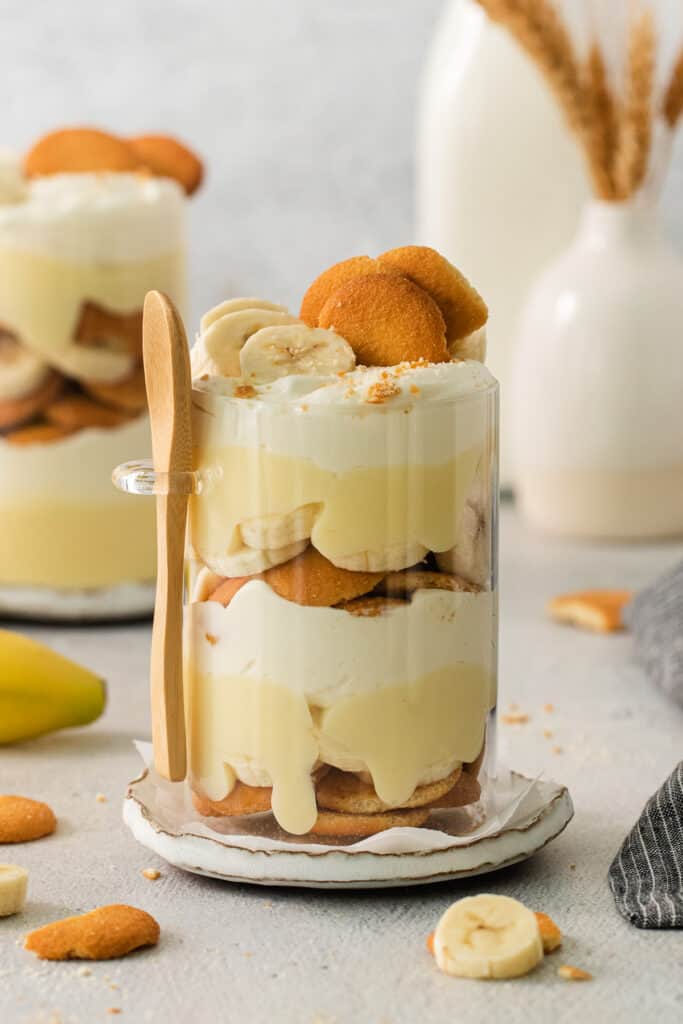 a dessert with bananas and cream on a plate.