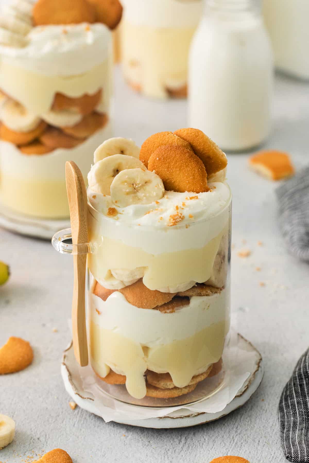 a dessert with bananas and cream on a plate.