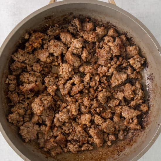 ground beef in a pan on a white background.