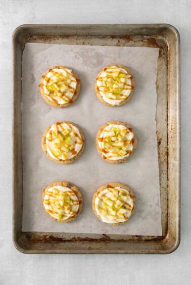 a baking tray filled with mini desserts on top of a table.