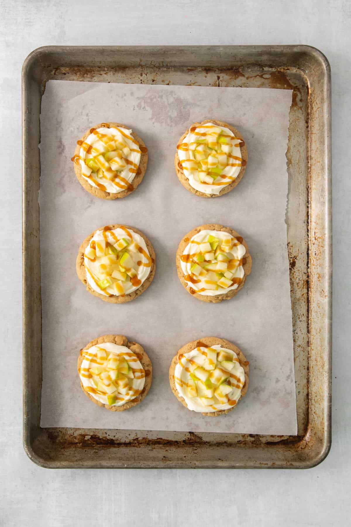 a baking tray filled with mini desserts on top of a table.