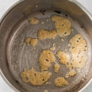 a pan filled with food on top of a stove.