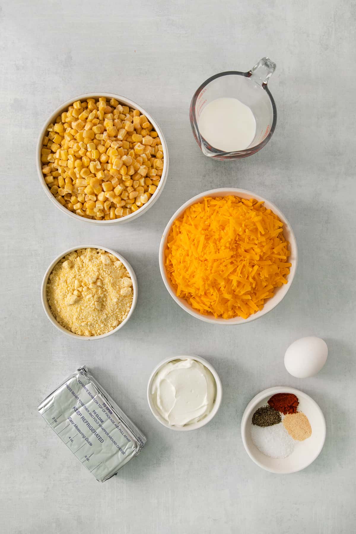 a table topped with bowls filled with different types of food.