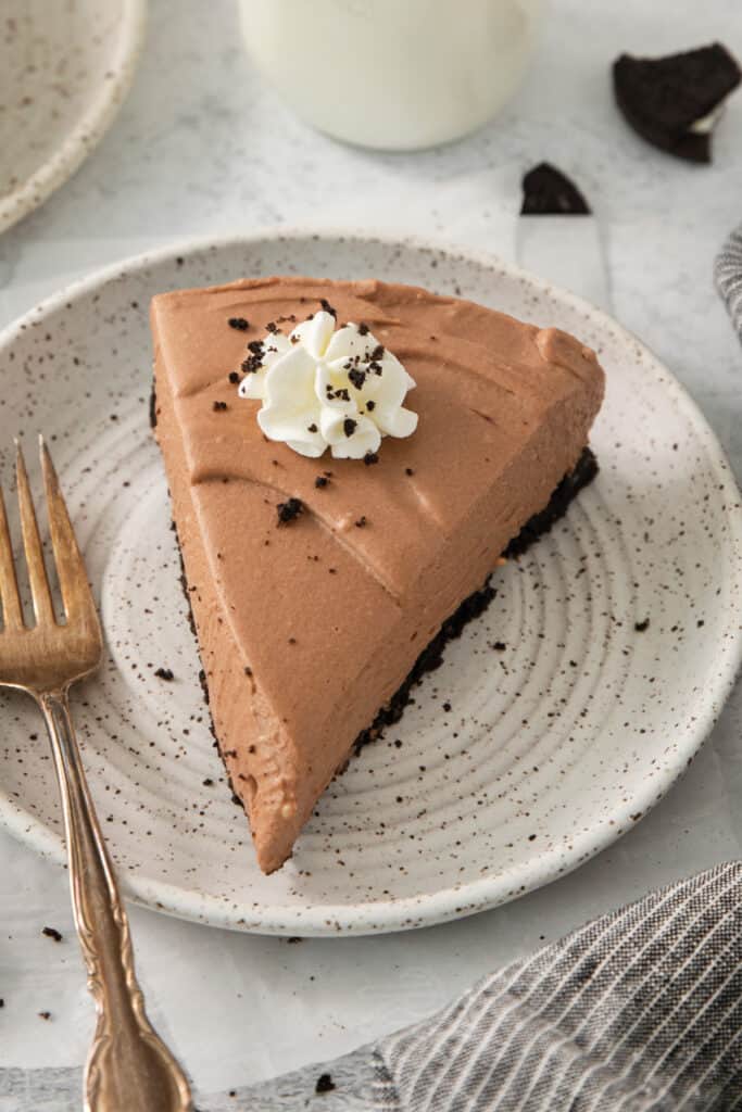 a slice of chocolate pie on a white plate.