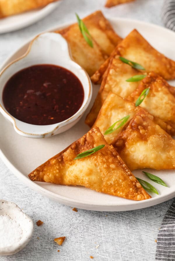 Cream cheese rangoon on a plate.