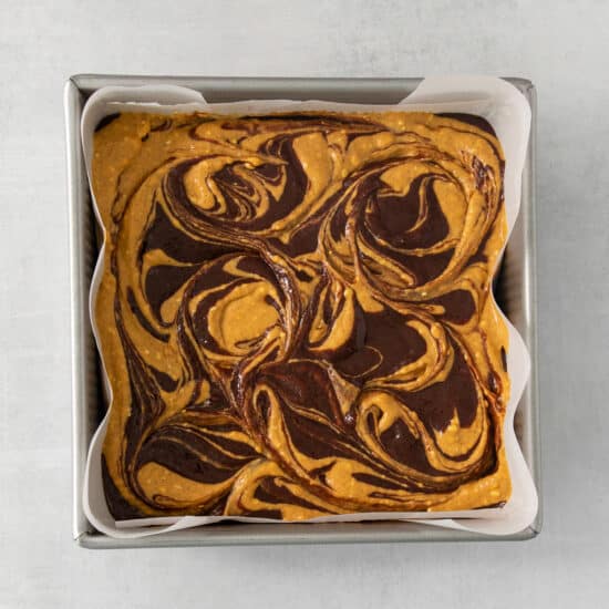 a brownie in a pan with swirls on it.