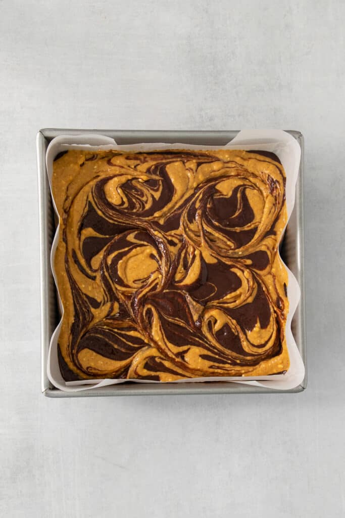 a brownie in a pan with swirls on it.